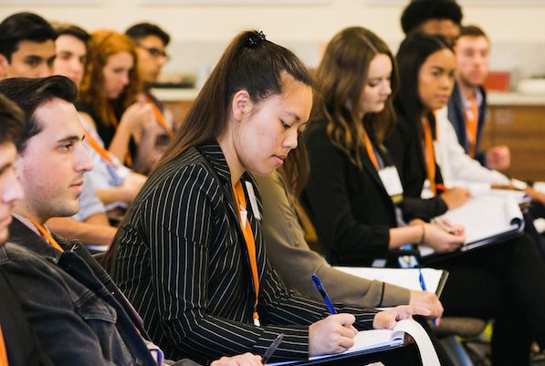 Students in a career development session taking notes.